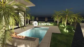 Foto de uma piscina externa com paisagismo em uma propriedade.