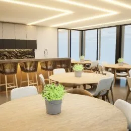 Mesa de jantar de madeira com cadeiras em um ambiente interno.