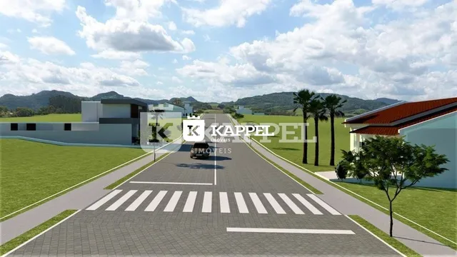 Fachada de uma residência com paisagismo e acesso por pista pavimentada.