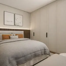 Quarto com cama e armários embutidos na parede.