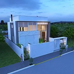 Fachada moderna de uma casa branca com muro de perímetro em Lajeado, Brasil.