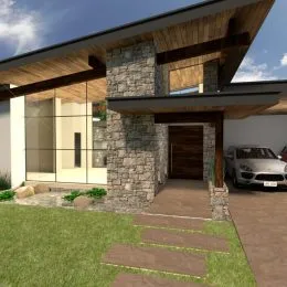 Fachada de uma residência com revestimento de pedra e área gramada.