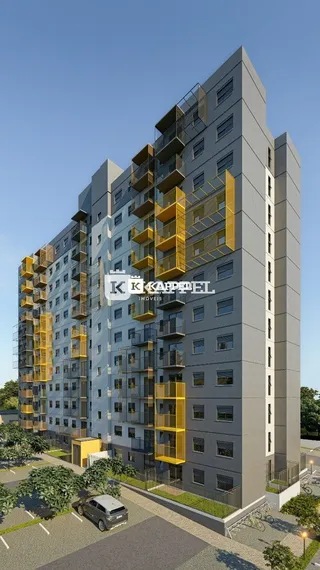 Fachada de um prédio residencial moderno com detalhes em amarelo em Lajeado, Brasil.