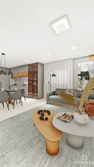 Ambiente interno moderno com cozinha e sala de jantar em um espaço aberto.