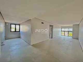 Ambiente interno de uma propriedade em Lajeado, Brasil, com paredes brancas e piso claro.