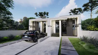 Fachada moderna de uma casa em Lajeado, Brasil, com paisagismo e entrada pavimentada.