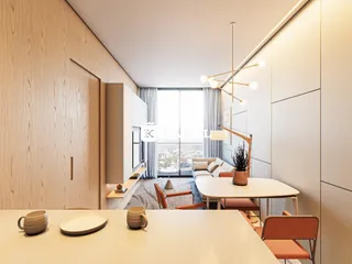 Uma foto de uma sala de jantar moderna com mesa de madeira clara e iluminação contemporânea.