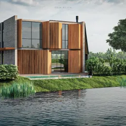 Fachada moderna de uma residência com revestimento de madeira e paisagem de água no primeiro plano.