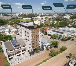Vista aérea de um edifício residencial em Lajeado, Brasil, com entorno verde.