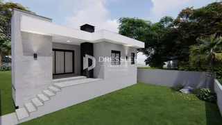 Fachada moderna de uma casa em Lajeado, Brasil, com jardim gramado.