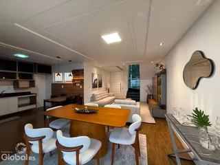 Sala de estar e jantar moderna com piso de madeira e móveis de design.