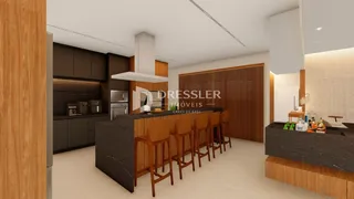 Vista da cozinha moderna com ilha e bancadas escuras.