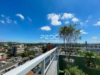 Vista da varanda de um imóvel em Lajeado, Brasil, com céu azul e nuvens.