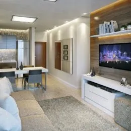 Sala de estar com sofá e iluminação clara.