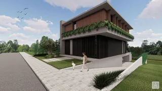 Fachada de uma casa moderna com telhado verde em Lajeado.