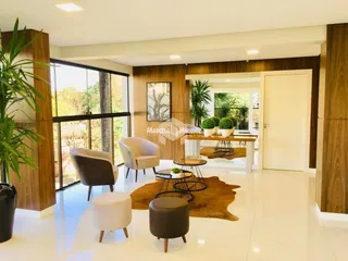 Sala de estar com piso claro e decoração moderna em um imóvel no Brasil.