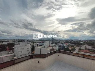 Vista panorâmica da cidade de Lajeado sob um céu nublado.