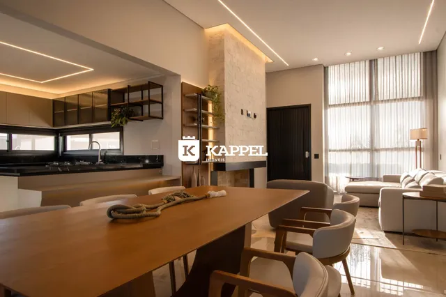 Ambiente de sala de jantar e cozinha em um apartamento moderno.