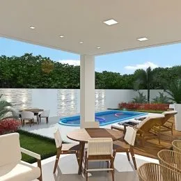 Vista de um espaço externo com piscina e vegetação.