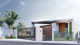 Fachada moderna de uma residência com cerca e paisagismo em Lajeado, Brasil.