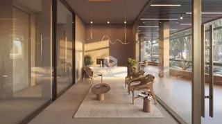 Sala de estar moderna com grandes portas de vidro e iluminação natural.