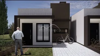 Fachada de uma casa moderna em Lajeado, Brasil, com jardim e calçada.