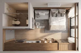 Quarto com cabeceira e armário em madeira.