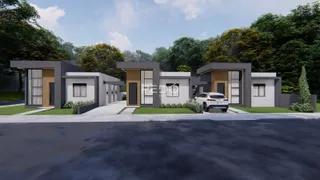 Fachada moderna de uma casa em Lajeado, Brasil, com paisagismo ao redor.