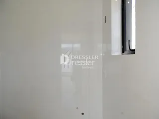 Parede interna branca de uma residência em Lajeado.