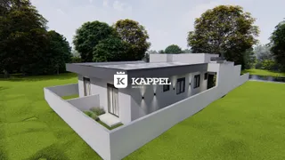 Vista externa de uma casa moderna com jardim verde em Lajeado.
