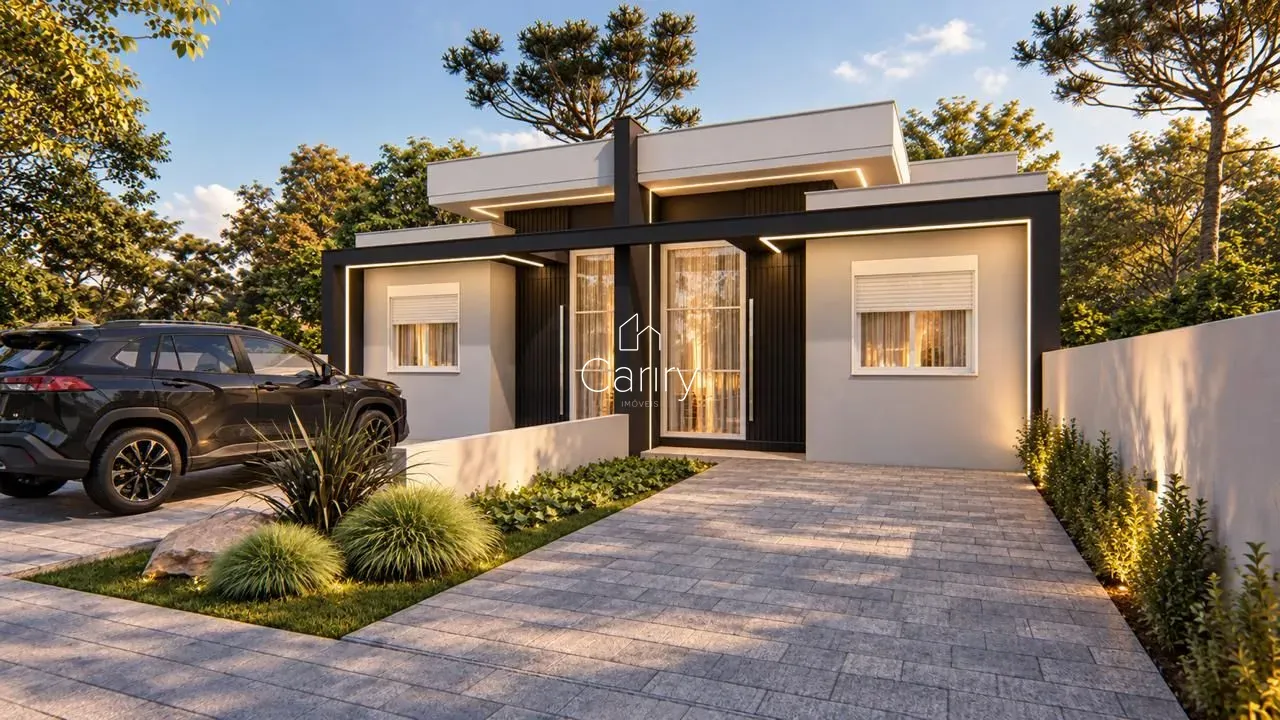 Fachada moderna de uma residência em Lajeado, Brasil, com paisagismo frontal e garagem.