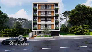 Fachada de um prédio residencial em Lajeado com vegetação ao redor.