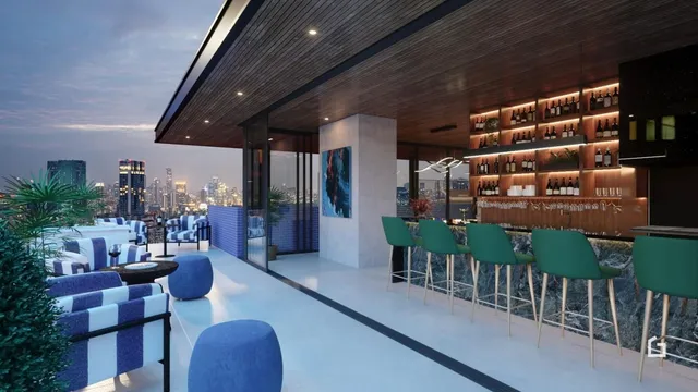 Uma área de lazer moderna com mobiliário externo e um bar de madeira.