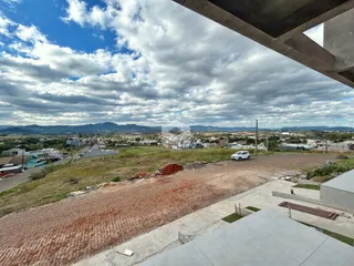 Vista panorâmica da paisagem de Lajeado, Brasil, com colinas ao fundo.