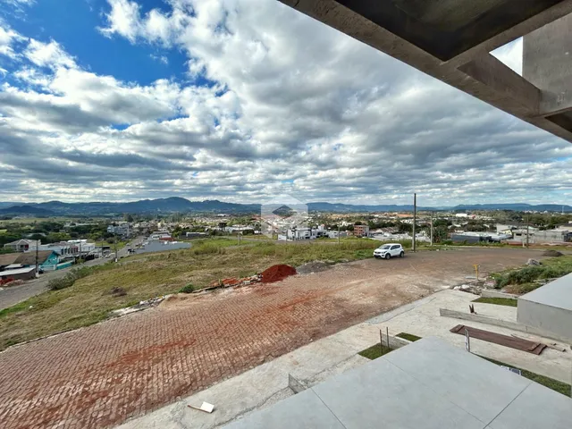 Vista panorâmica da paisagem de Lajeado, Brasil, com colinas ao fundo.