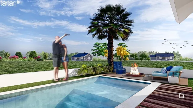 Vista de uma piscina e jardim em uma propriedade residencial.