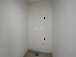 Parede interna branca de um imóvel em Lajeado.