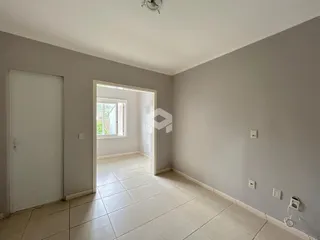 Hall de entrada com piso de cerâmica e paredes cinzas na propriedade.