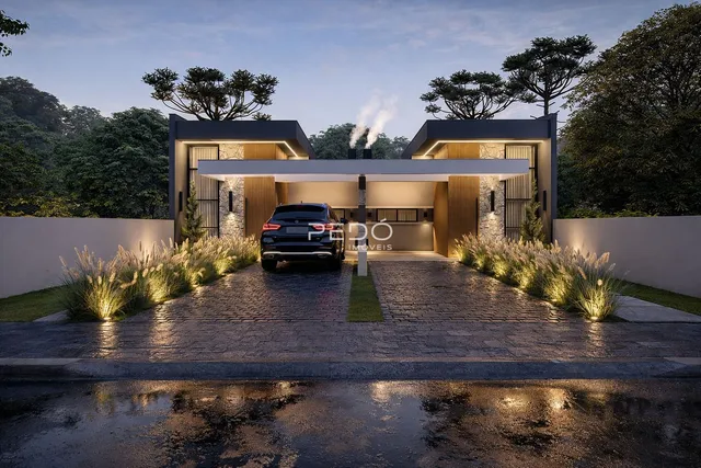 Fachada moderna de uma residência em Lajeado, Brasil, com paisagismo frontal.