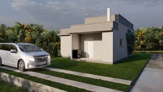 Fachada de uma casa moderna em Lajeado, Brasil, com paisagismo.