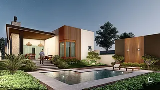 Fachada moderna de uma residência com piscina e jardim em Lajeado.