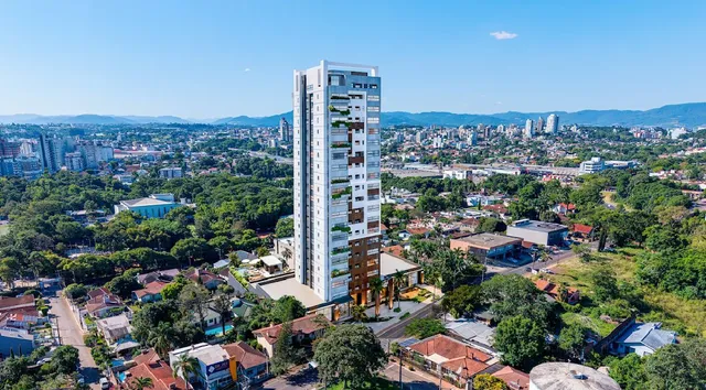 Vista aérea de uma área urbana com edifícios e vegetação na região de Lajeado.