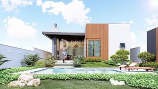 Fachada moderna de uma residência com piscina e jardim em Lajeado.