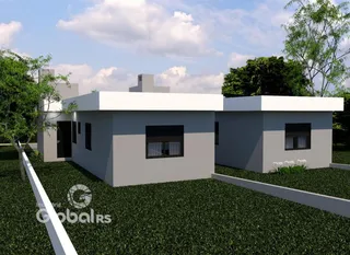 Fachada de uma residência moderna com jardim em Lajeado.