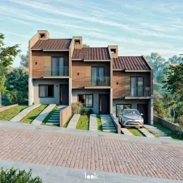 Fachada de uma residência moderna em Lajeado, Brasil, com revestimento de tijolos aparentes.