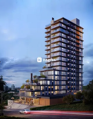 Fachada de um edifício residencial alto em Lajeado, Brasil, ao entardecer.