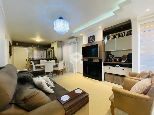 Sala de estar e jantar de um apartamento em Lajeado, Brasil.