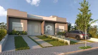 Fachada de uma casa moderna em Lajeado, Brasil, com jardim e entrada.