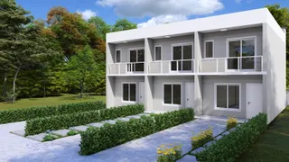 Fachada moderna de uma casa de dois andares com jardim frontal.