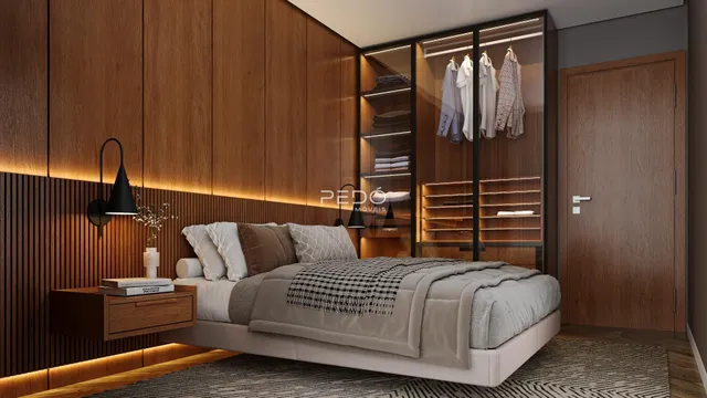 Quarto moderno com cabeceira e armários em madeira.